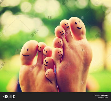 Smiley Faces On A Pair Of Feet On All Ten Toes Very Shallow Dof Big