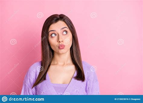portrait of impressed nice girl blow kiss look empty space wear lilac sweater isolated on pink