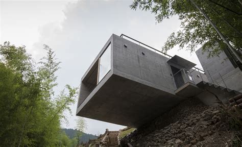Striking Green Roofed House Cantilevers Over A Cliff In Japan