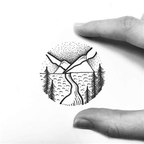 Two Hands Holding Up A Piece Of Paper With Trees And Mountains On It