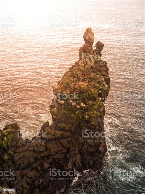 Londrangar Rock Lava Formation In The Sea Eroded Basalt Cliffs In The