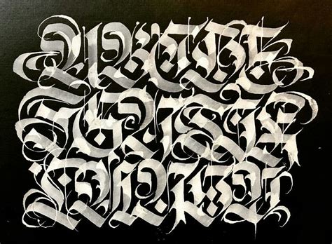 Some Type Of Graffiti Written In White On Black Paper With The Letters