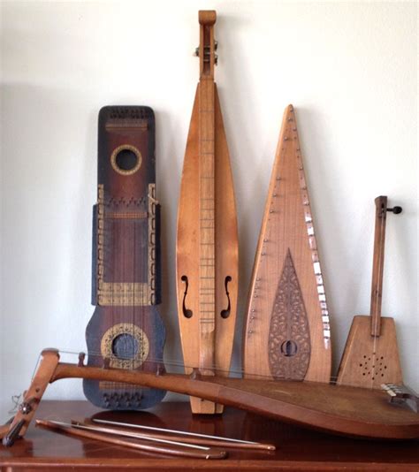 Unusual Stringed Musical Instruments Second From Left Is A Dulcimer