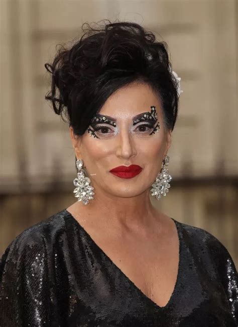 Glitzy Nancy Dellolio Covers Her Face In Sequins To Match Her Dress At