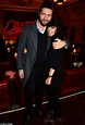 Claudia Winkleman cuddles up to husband Kris Thykier as they enjoy a ...