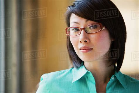 Close Up Of Asian Woman Wearing Eyeglasses Stock Photo Dissolve