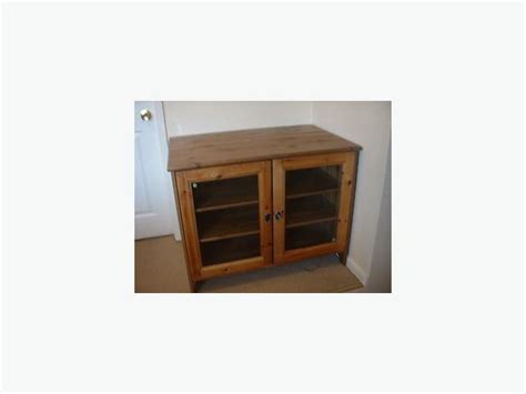 This entertainment center will hide your tv when not in use. EUC: Ikea Leksvik Solid Pine TV Cabinet With Glass Doors ...