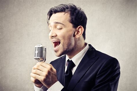 Man Singing Into A Microphone Stock Image Image Of Shout Microphone