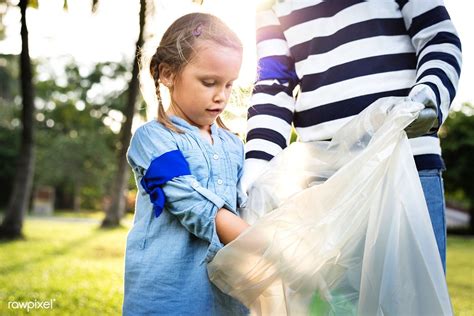 Download Premium Image Of Kids Picking Up Trash In The Park 431165