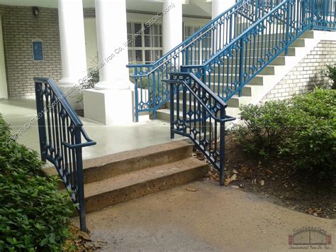 Capture the elegance of a european estate by trimming stone steps with a wrought iron railing, then topping it with a wood handrail stained to match your front door. Wrought Iron Stair Railing 3