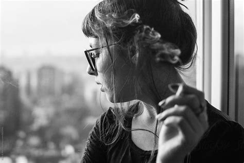 Portrait Of Woman Who Smoking A Cigarette By Stocksy Contributor Katarina Simovic Stocksy
