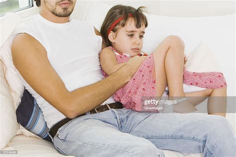 Girl Sitting On Her Fathers Lap Photo Getty Images