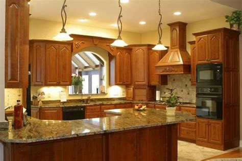 Oak kitchen cabinets with white granite countertop. New Venetian Gold - Granite | Granite countertops kitchen ...