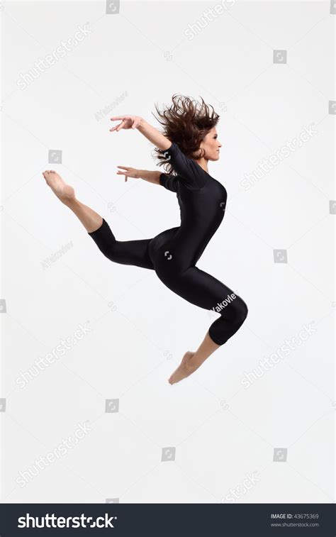 Modern Dancers Poses In Front Of The White Background Stock Photo