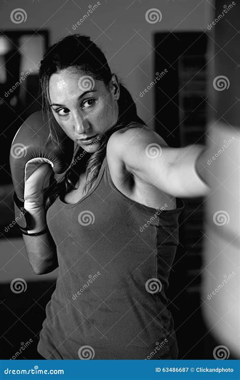 Portrait Of Young Female Boxer Fighting In Boxing Gloves Stock Image