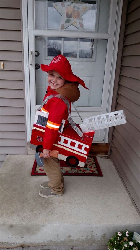 Iron the flag patch above the upper band on the right sleeve of the outfit. Homemade Halloween costume. Fireman costume. Firetruck made out of a diaper box. | Homemade ...