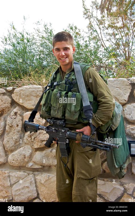 Armed Young Israeli Soldier On Guard Duty At Qumran National Park