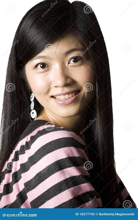 Smiling Chinese Girl Talking Over The Phone Royalty Free Stock Image