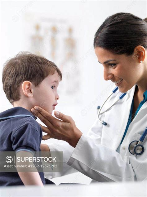 Paediatric Examination Doctor Checking A 3 Year Old Boys Glands To