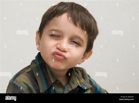 Young Boy Pulling A Funny Face Stock Photo Alamy