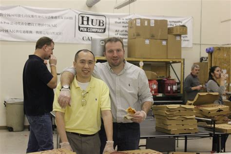 It Guru Hugh Nguyen And Production Manager Dave Borgatti Serve Pizza To Production Workers Pen