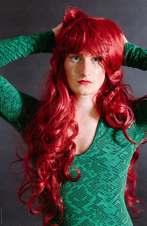 Non Binary Guy In Drag Wearing Green Dress And Red Wig By Stocksy Contributor Kkgas Stocksy