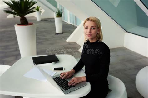 Intelligent Female Secretary Posing In Modern Office Interior During