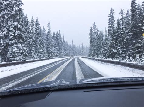 Car Driving On Snow Covered Snowy Mountain Road In Winter Snow Driver