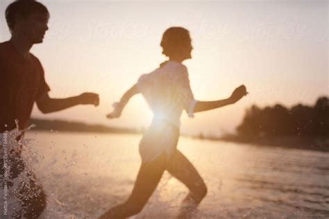 Couple Running Out Of Sea By Stocksy Contributor Mattia Couple Running Total Body Workout