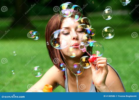 Young Woman Blowing Bubbles Stock Photo Image Of Outdoors Cloud 4140586