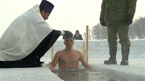 Russian Orthodox Epiphany Siberian Believers Plunge Under Icy Water In C Conditions