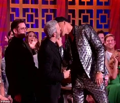 Andy Cohen Gets Kissed On The Cheek By Male Guest