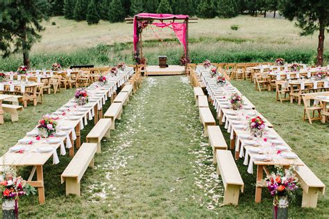 Casual Outdoor Reception With Wood Benches And Colorful Centerpieces