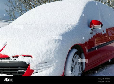 Car Covered In Layer Of Fresh Snow Stock Photo Alamy
