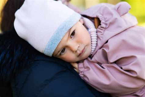 Close Up Of Baby Girl Resting On Motherand X27s Shoulder Stock Image