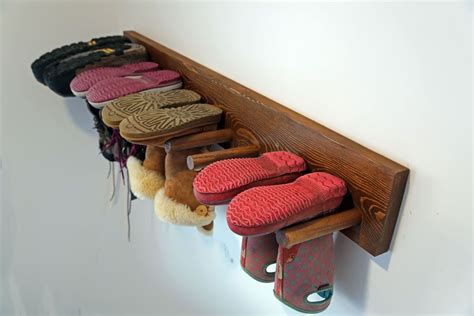 You have a bench to sit on to take your shoes off and on. Wall Boot Rack Plans | Diy shoe storage, Diy storage bench ...