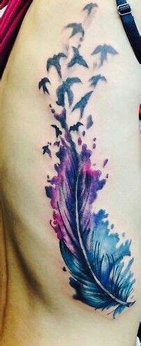 It is a different twist of the most commonly used tattoo idea. Beautifully colored feather with birds | Feather tattoos ...