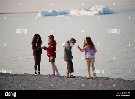 Girls Walking Along The Beach At Gimli Manitoba Canada Stock Photo