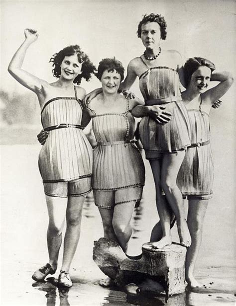 Three Women In Bathing Suits Standing Next To Each Other With Their Hands On Their Hips