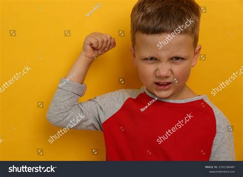 Angry Little Boy On Yellow Background Stock Photo 2191196487 Shutterstock