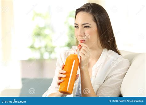 Woman Drinking Orange Juice With A Straw Stock Photo Image Of Holding