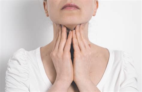 Premium Photo The Woman Has A Thyroid Disorder Sore Throat Inflamed