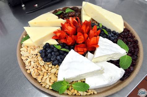 International Cheese Platter An Assortment Of 3 Cheeses With Fruit