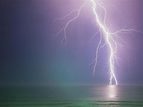 Lightning Storm Over Ocean Photographic Print By Peter Wilson