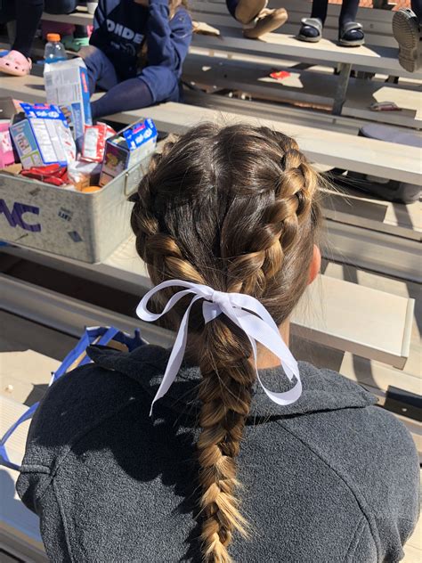 This hairstyle is a fan favourite and it s easy to see why. softball hairstyles | Volleyball hairstyles, Sports ...