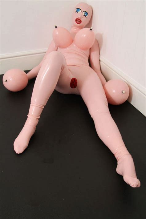 fetish sub wearing a latex inflatable doll outfit