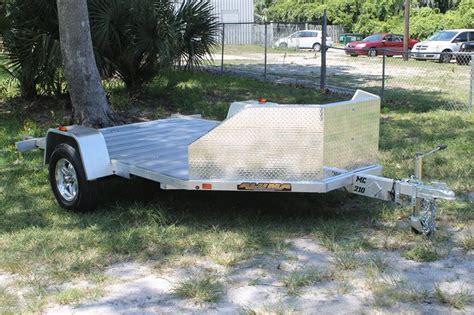 Motorcycle carrying trailers may be open or enclosed. Open Motorcycle Trailer for Sale with Stone Guard
