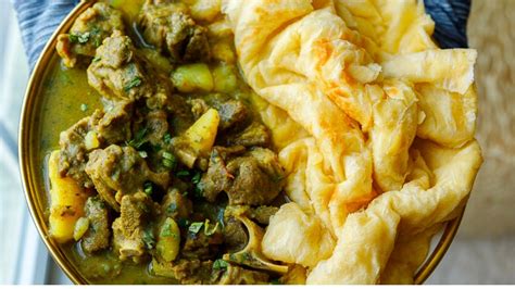 Amazing Curry Goat With Potato And Paratha Roti Trini Buss Up Shot Roti Youtube