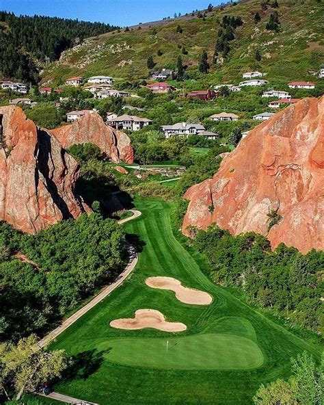 An Aerial View Of A Golf Course In The Mountains