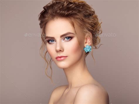 Fashion Portrait Of Young Beautiful Woman With Elegant Hairstyle Stock